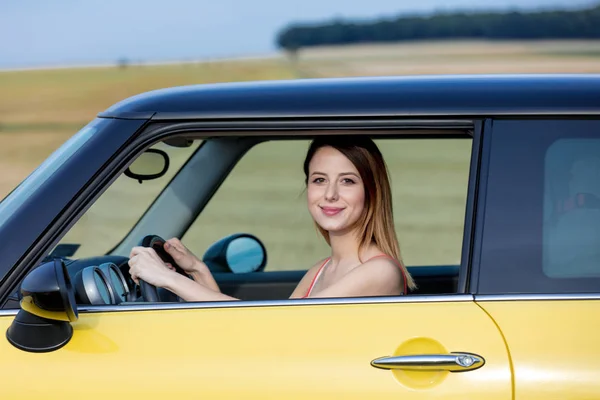 Young girl sitting in car — Stock Photo, Image