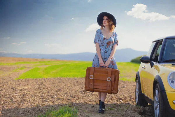 Redhead woman with map and suitcase — Stock Photo, Image