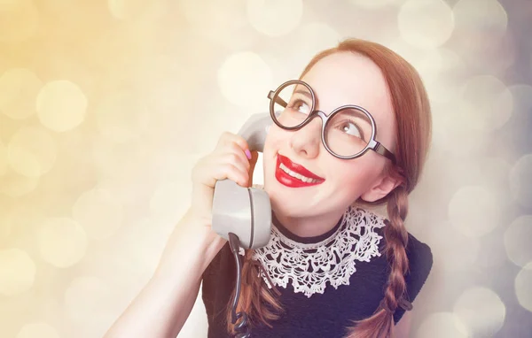 Redhead girl with green phone — Stock Photo, Image