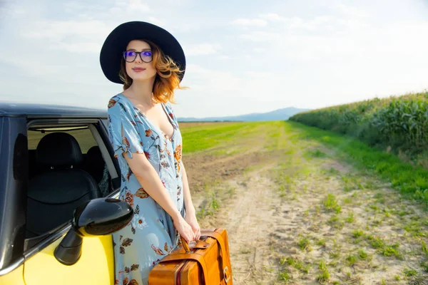 Young woman with suitcase — Stock Photo, Image