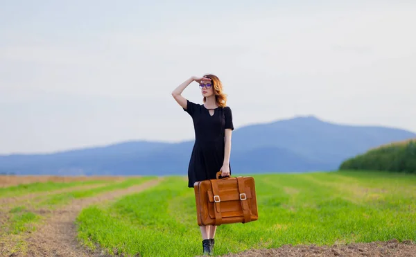 Young woman in black dress — Stock Photo, Image