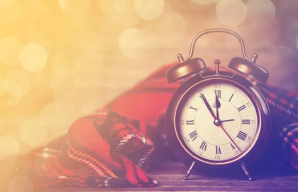 Alarm clock and scarf — Stock Photo, Image