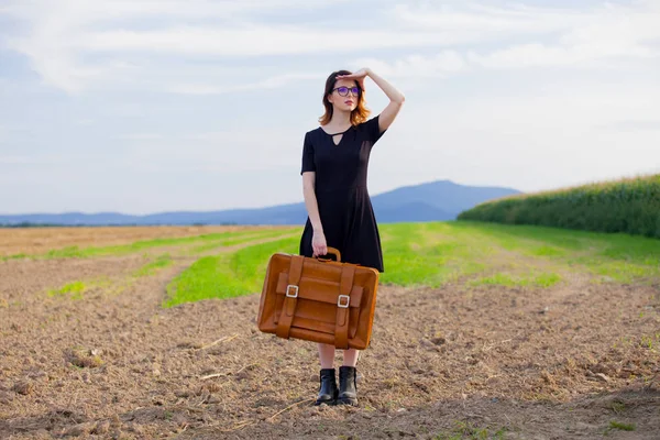 Young woman in black dress — Stock Photo, Image