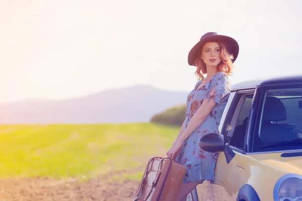 Redhead woman with map and suitcase — Stock Photo, Image