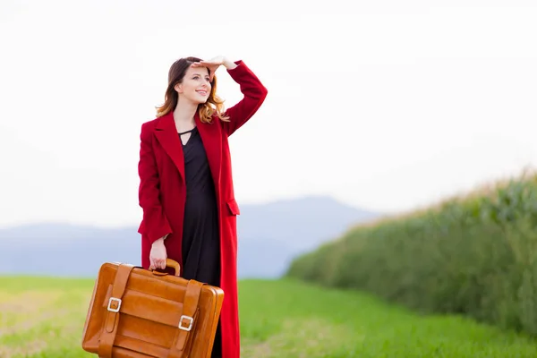 Young woman in red coat — Stock Photo, Image