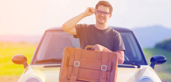 Young man with travel suitcase — Stock Photo, Image