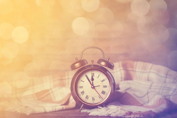 Alarm clock and scarf — Stock Photo, Image