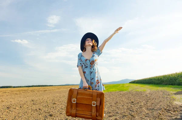 Beautiful woman with suitcase — Stock Photo, Image