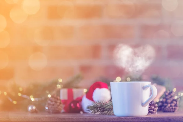 White Cup of tea near gift — Stock Photo, Image