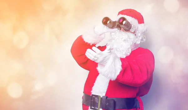 Santa Claus con prismáticos —  Fotos de Stock