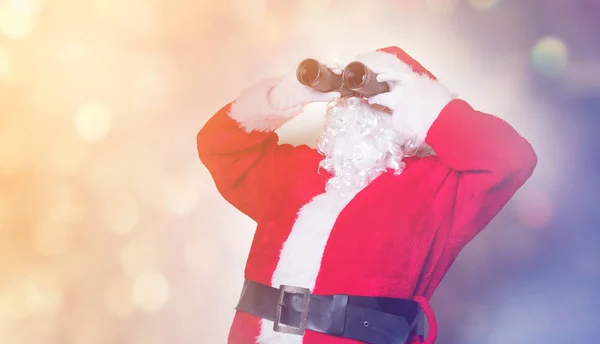 Papai Noel segurando binóculos — Fotografia de Stock