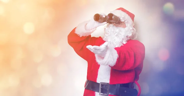 Santa Claus hospodářství dalekohled — Stock fotografie