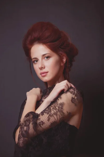 Young woman in black dress — Stock Photo, Image