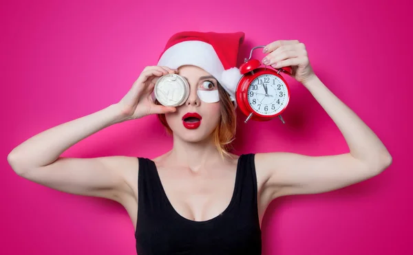 Woman holding alarm clock — Stock Photo, Image