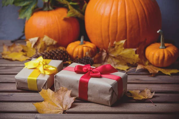 Gift boxes with pumpkins — Stock Photo, Image