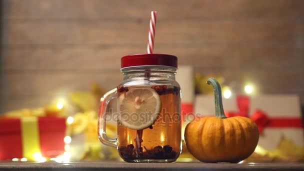 Little pumpkin with jar of tea — Stock Video