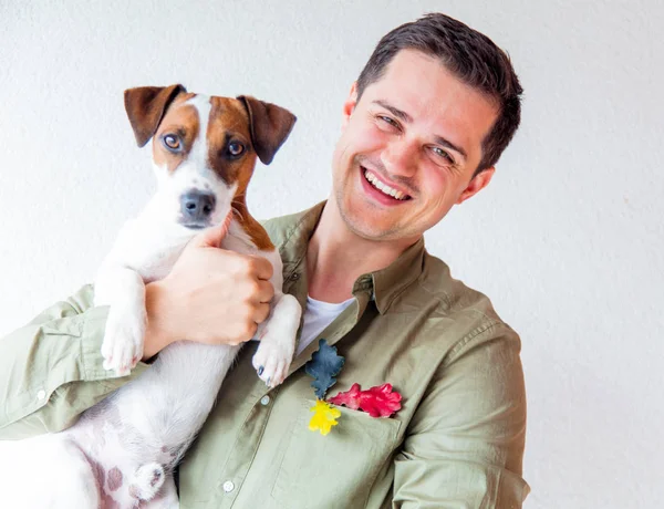 Man with dog and oak leaves — Stock Photo, Image