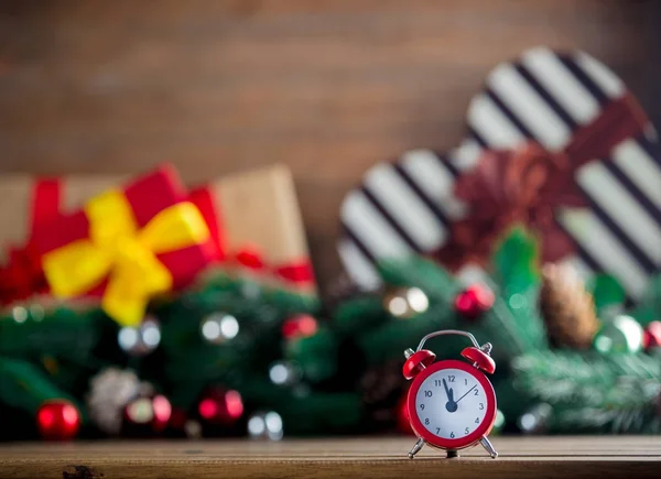 Alarm clock on wooden table — Stock Photo, Image