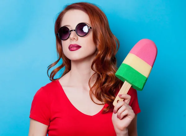 Redhead woman with ice-cream toy — Stock Photo, Image
