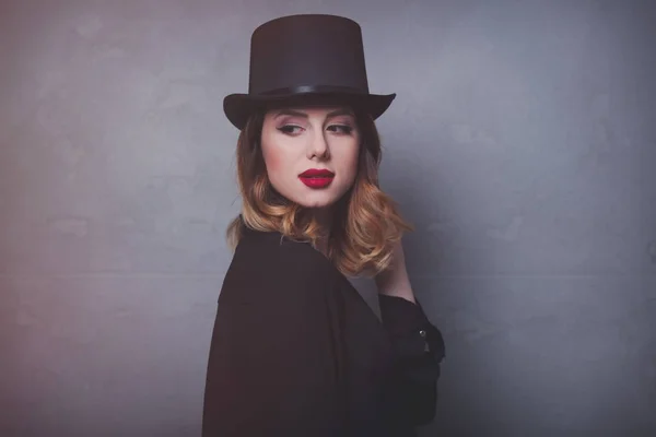 Redhead girl in top hat — Stock Photo, Image