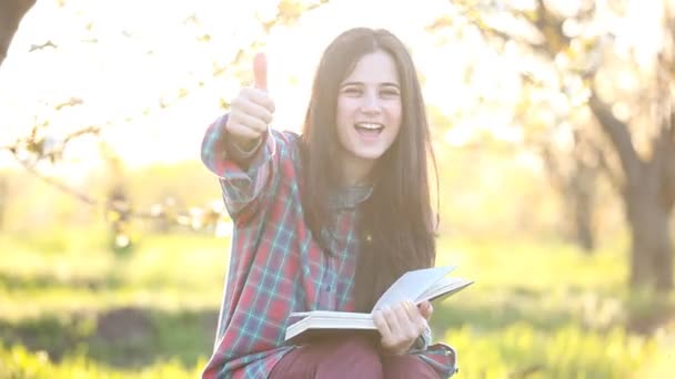 Student woman in shirt with book — Stock Video