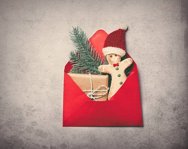 Christmas gifts in red envelope — Stock Photo, Image