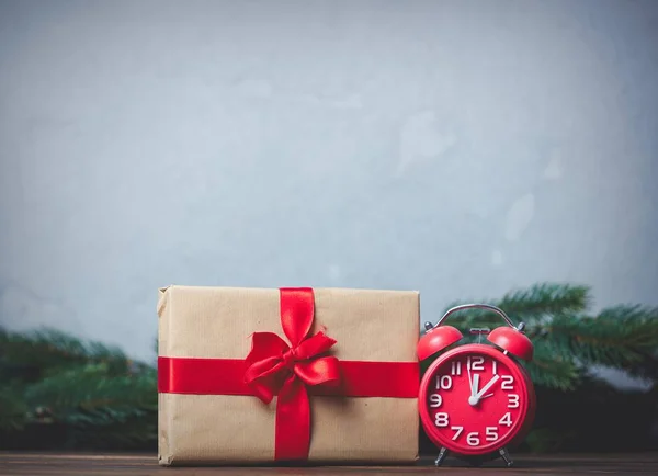 Christmas gift and alarm clock — Stock Photo, Image