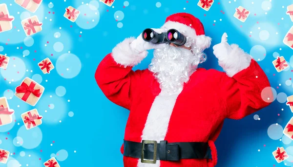 Anta Claus met verrekijker — Stockfoto