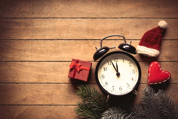 Christmas decoration and alarm clock — Stock Photo, Image