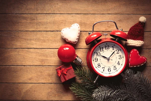 Christmas decoration and alarm clock — Stock Photo, Image