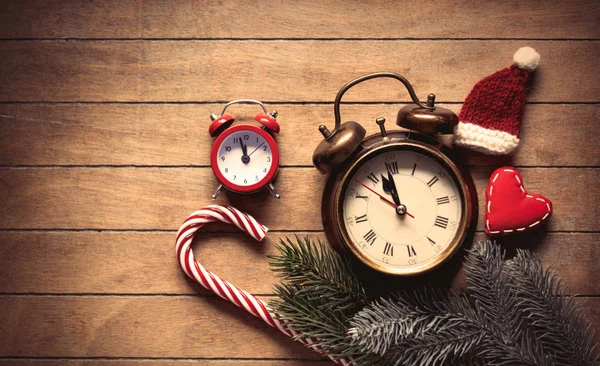 Christmas decoration and alarm clock — Stock Photo, Image