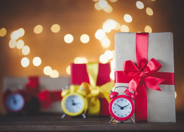 Christmas gifts and vintage alarm clocks — Stock Photo, Image