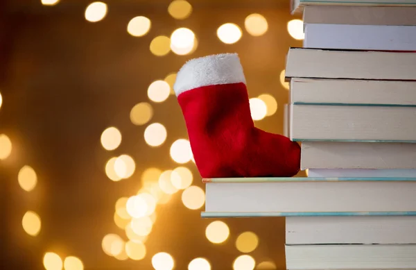 Pile of books and fairy lights — Stock Photo, Image