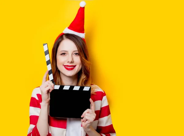 Redhead woman with filmmaking clapperboard — Stock Photo, Image