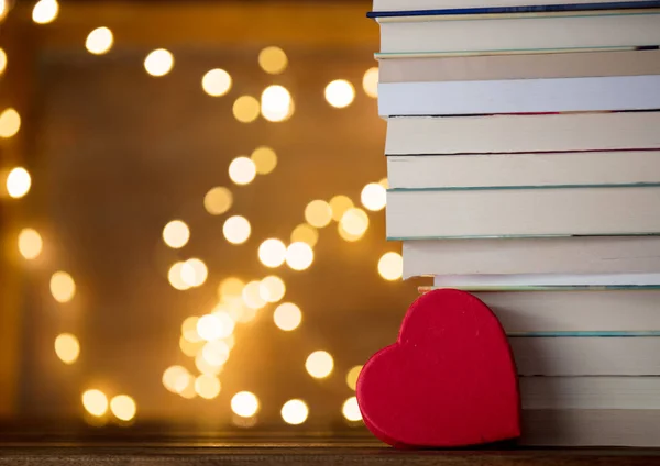 Pile of books and fairy lights — Stock Photo, Image