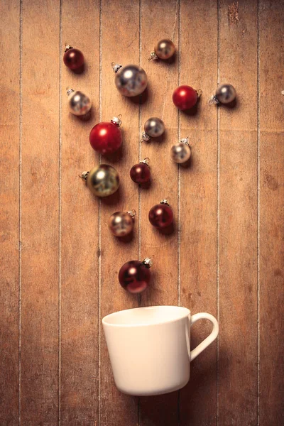 White cup with baubles — Stock Photo, Image