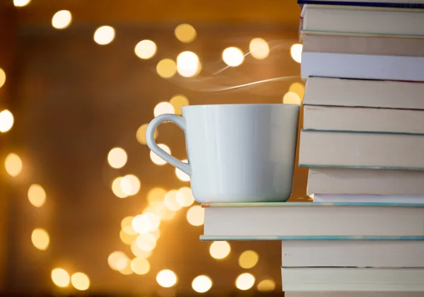 Pile of books and fairy lights — Stock Photo, Image