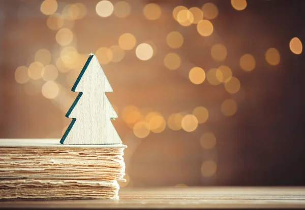 Christmas tree toy and old books — Stock Photo, Image