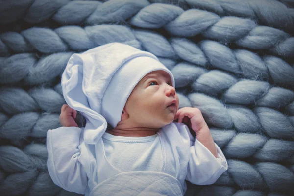 Funny Little Baby Wearing White Clothes Hat Lying Knitted Rug — Stock Photo, Image