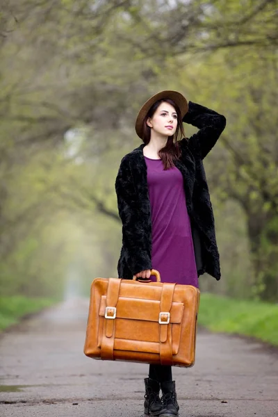 Young girl with suitcase — Stock Photo, Image