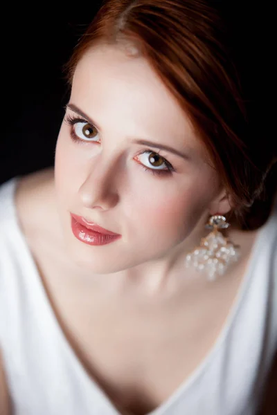 Portrait of young redhead woman with breautiful earrings — Stock Photo, Image