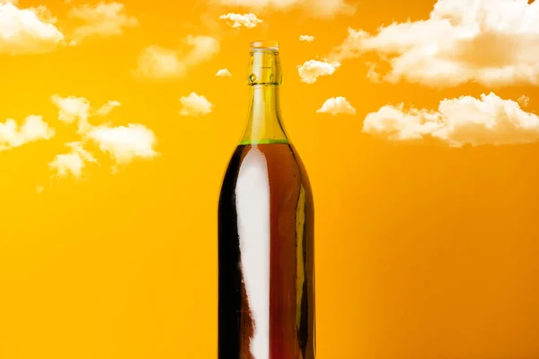Wine bottle with clouds around — Stock Photo, Image