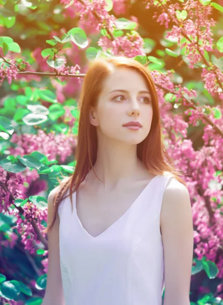 Young Redhead Girl White Dress Standing Tree Bushes Park Springtime — Stock Photo, Image