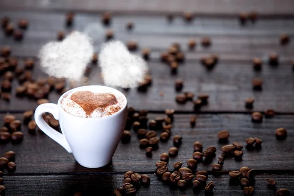 White Cup Coffee Two Heart Shapes Steam Beans Wooden Table — Stock Photo, Image