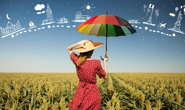 Flicka med paraply på sädesfält — Stockfoto