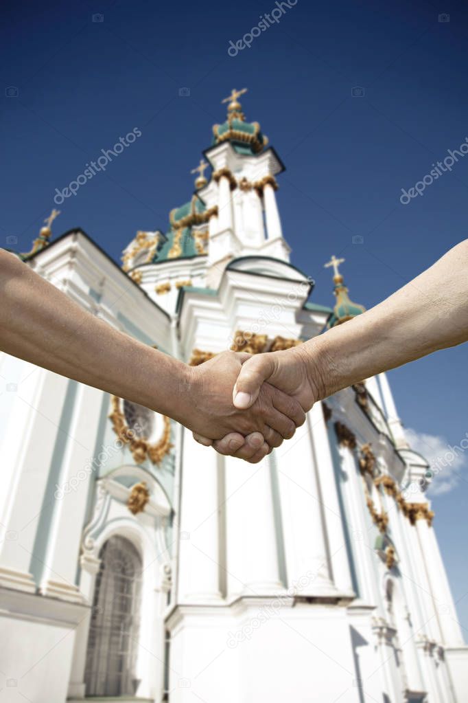 handshake of two conflict people