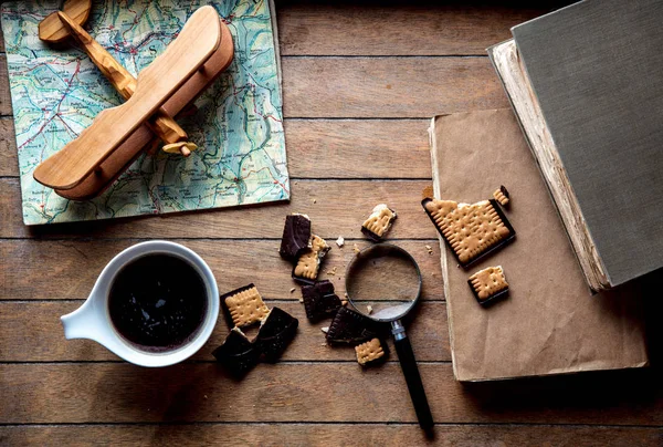 Cup with coffee and books with wooden plane — Stock Photo, Image
