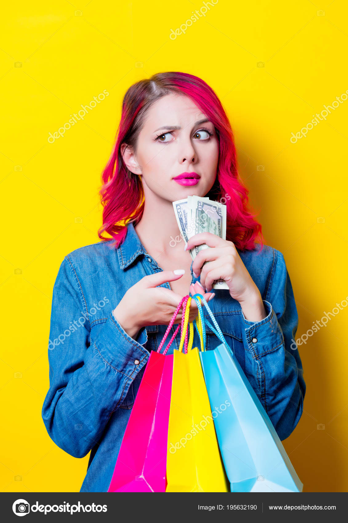 Young Pink Hair Girl Blue Shirt Holding Colored Shopping Bags