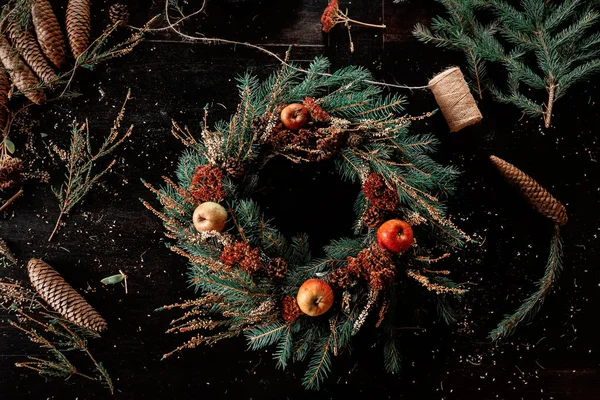 Handmade Christmas wreath on a table — Stock Photo, Image