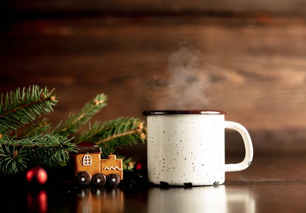 Cup of coffee and gingerbread cookie on a table — Stock Photo, Image